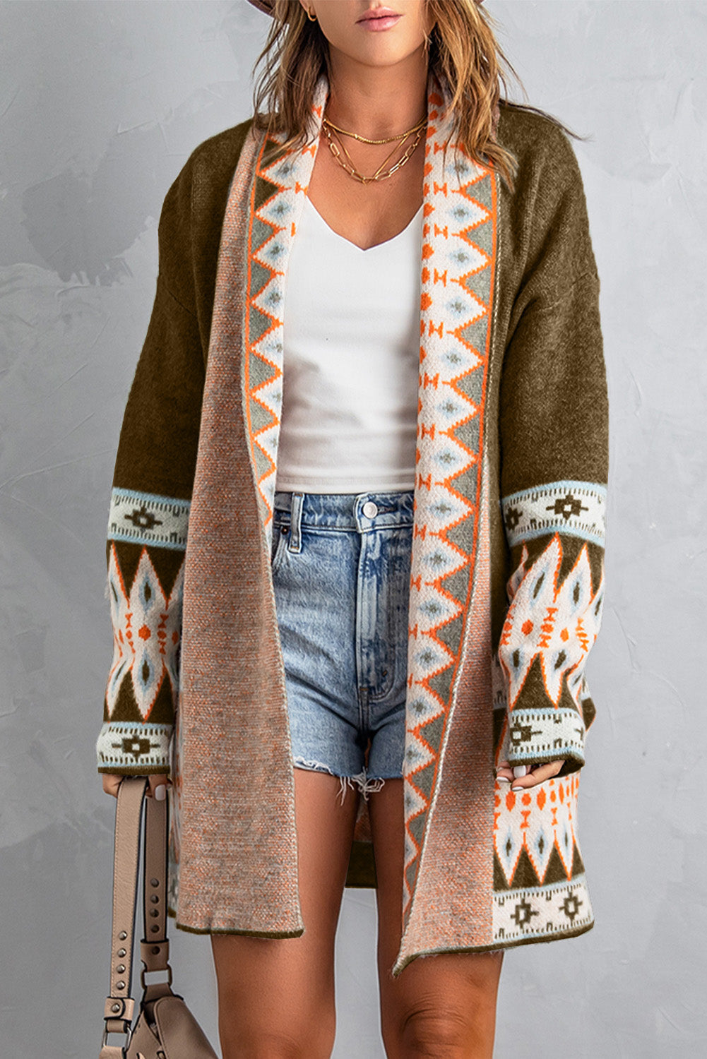 Brown Aztec print open-front knitted cardigan on a warm ivory boutique studio background