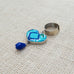 Folk Ring with Hanging Heart and Stone.