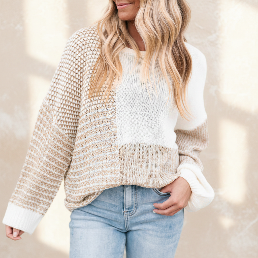 Oatmeal mixed pattern knit tie keyhole drop shoulder sweater on a warm ivory boutique studio background