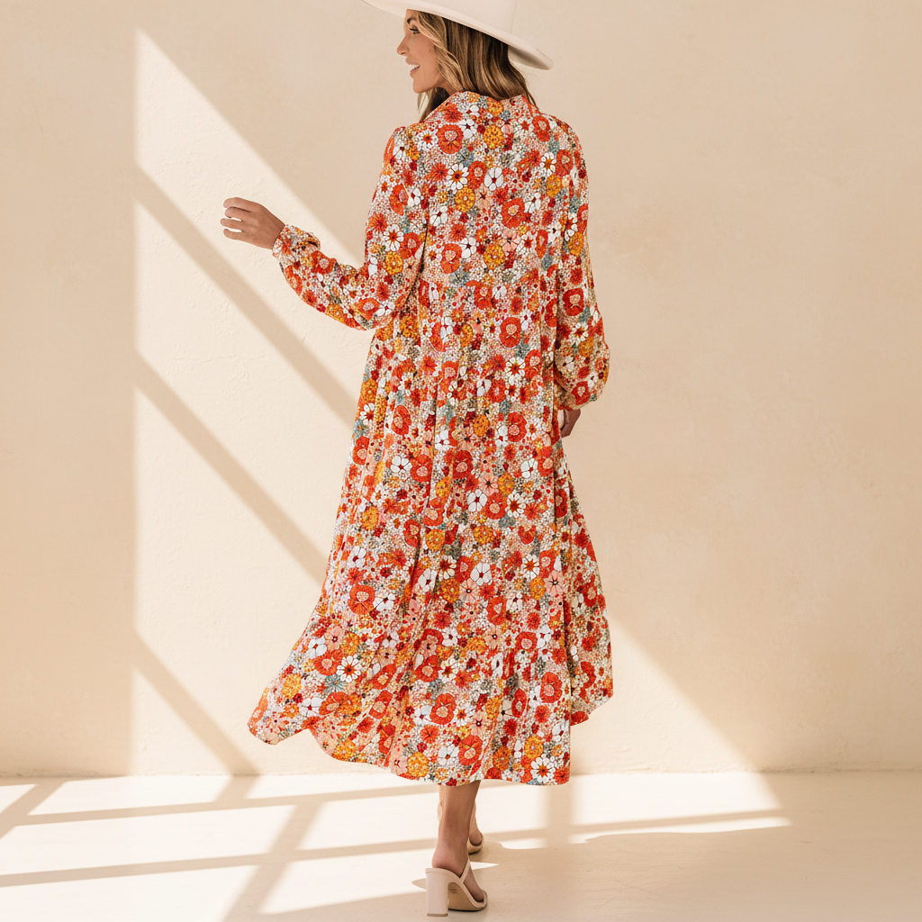 Multicolor boho floral collared long sleeve ruffled dress on a warm ivory boutique studio background