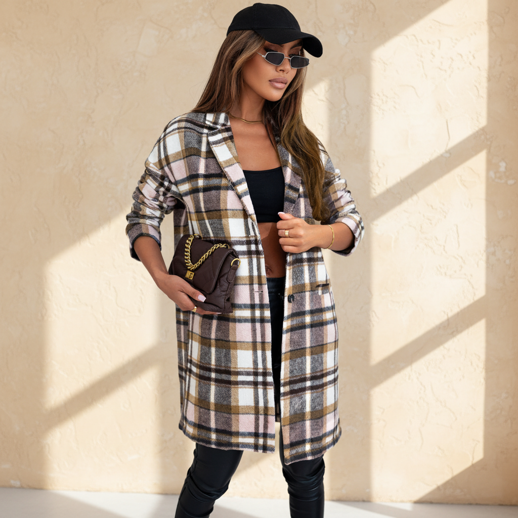 Pink plaid button up lapel jacket on a warm ivory boutique studio background