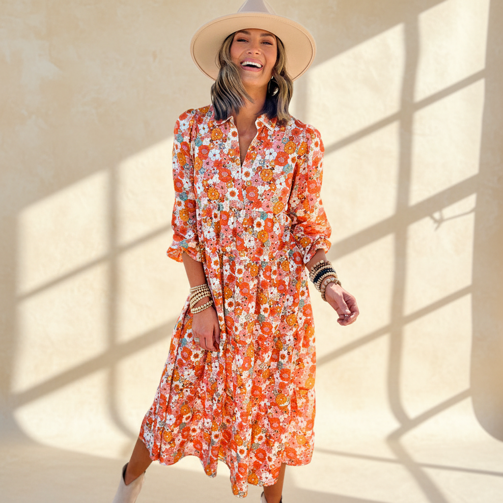 Multicolor boho floral collared long sleeve ruffled dress on a warm ivory boutique studio background