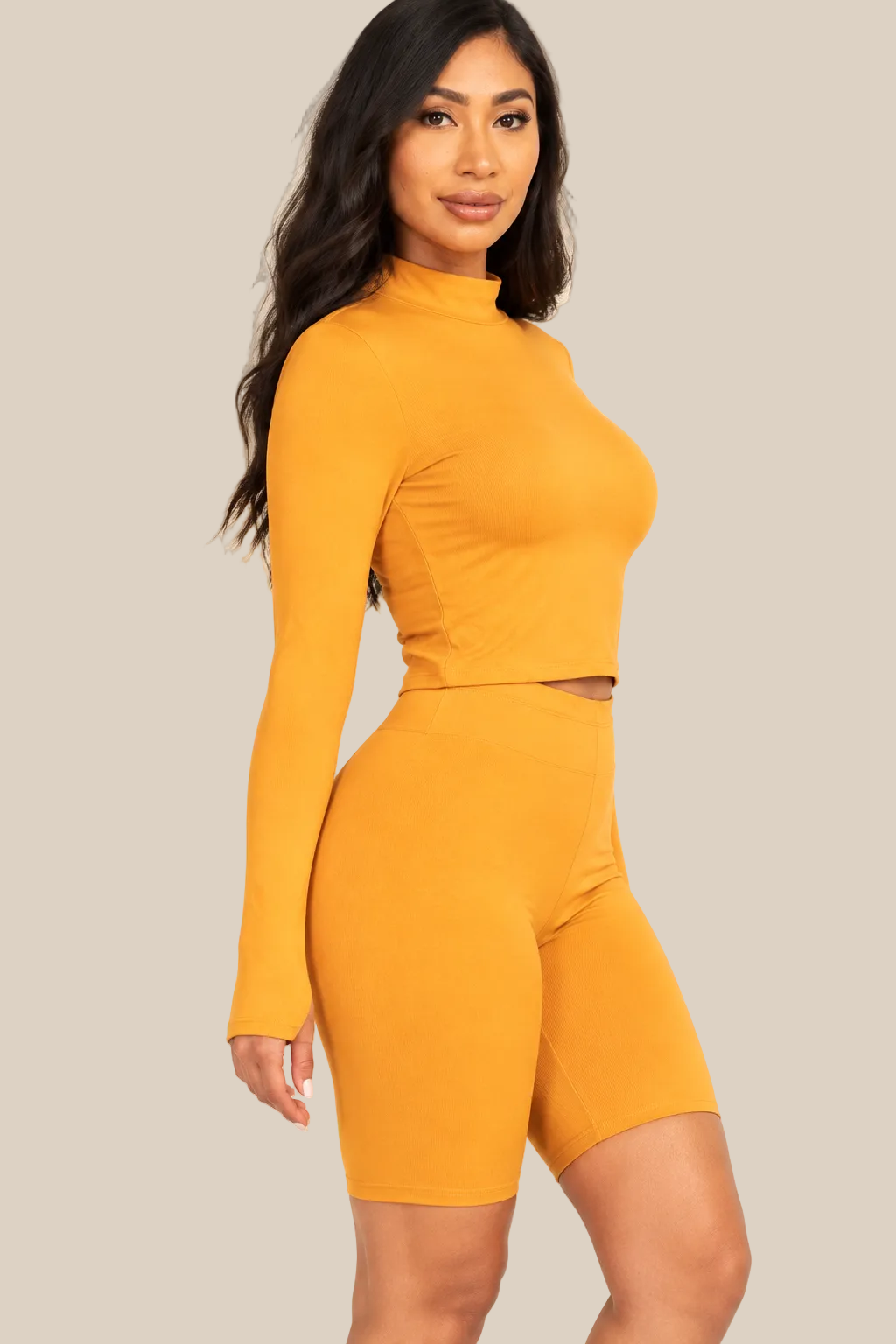 Tomato Cream mock neck top and biker shorts set, side-detail view on a warm ivory boutique background